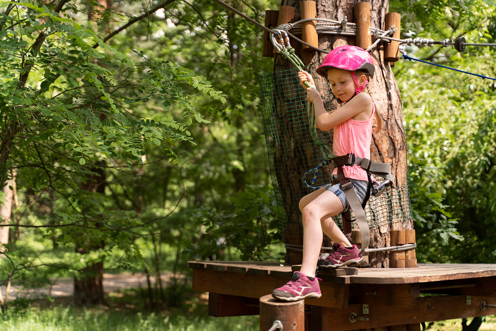 pretty-girl-having-fun-adventure-park.jpg